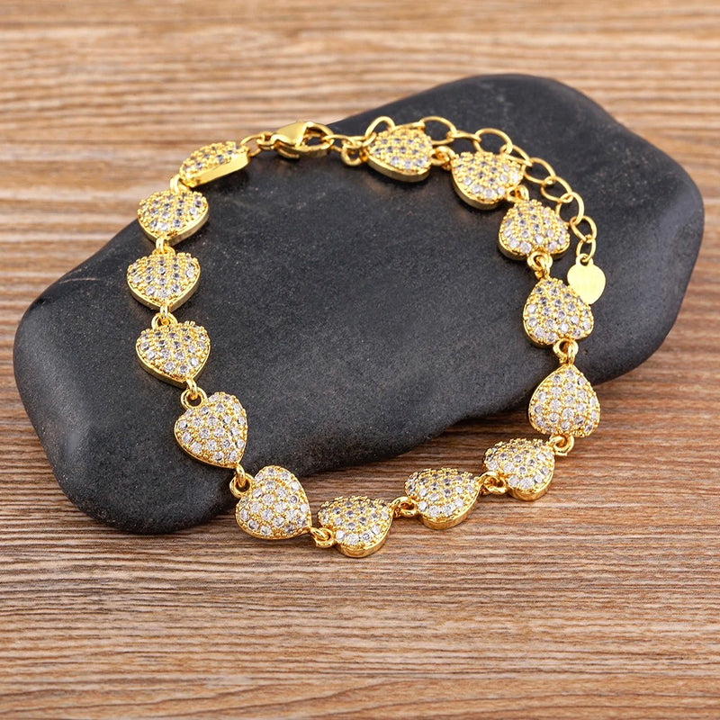 PULSEIRA CORAÇÕES CRAVEJADOS BANHADA EM OURO 18K - PLS 125