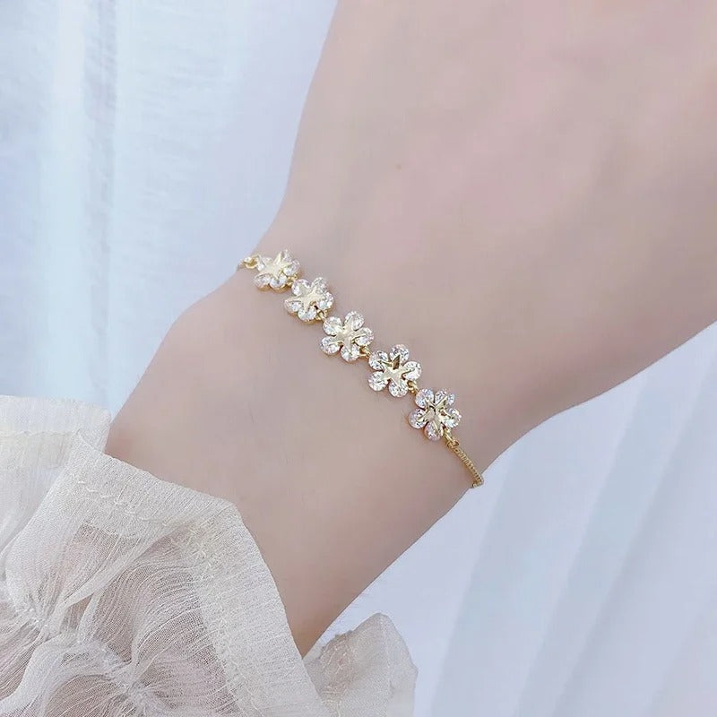 PULSEIRA PÉTALAS E ESTRELAS BANHADA EM OURO 18K - PLS 134