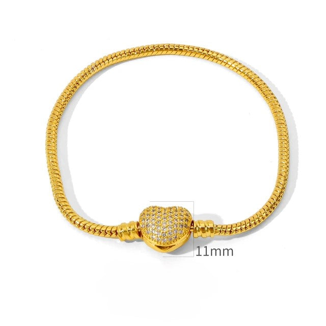 PULSEIRA PANDORA FECHO CORAÇÃO CRAVEJADO BANHADA EM OURO 18K - PL335