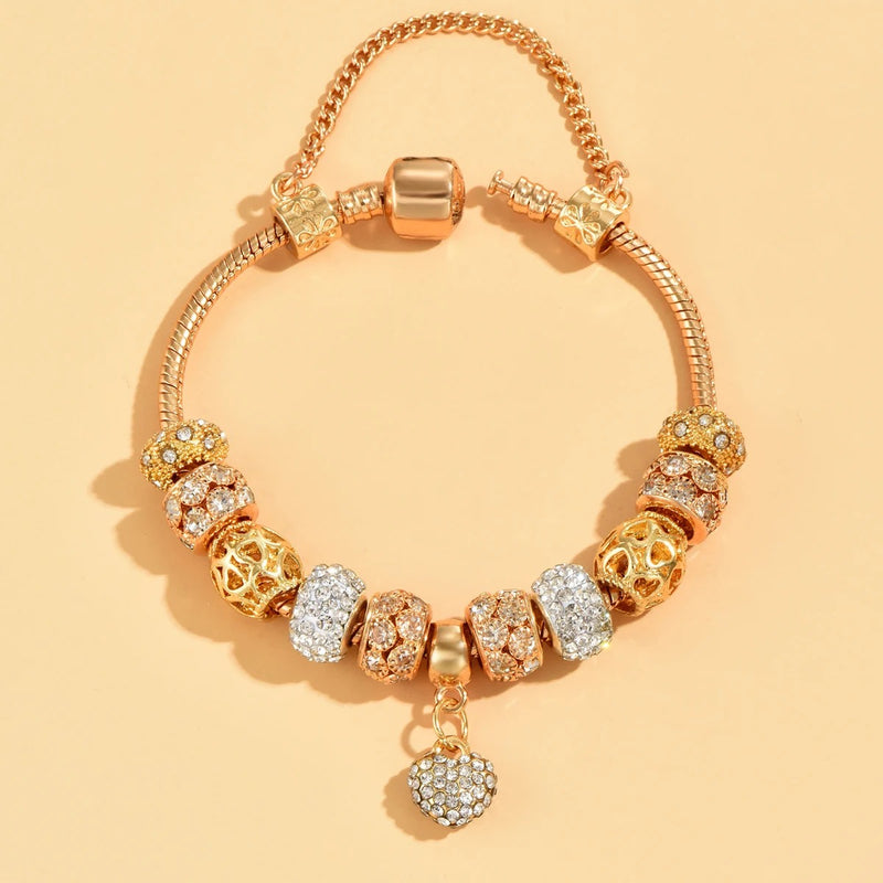 PULSEIRA PANDORA COM BERLOQUES CRAVEJADOS BANHADA EM OURO 18K - PL339